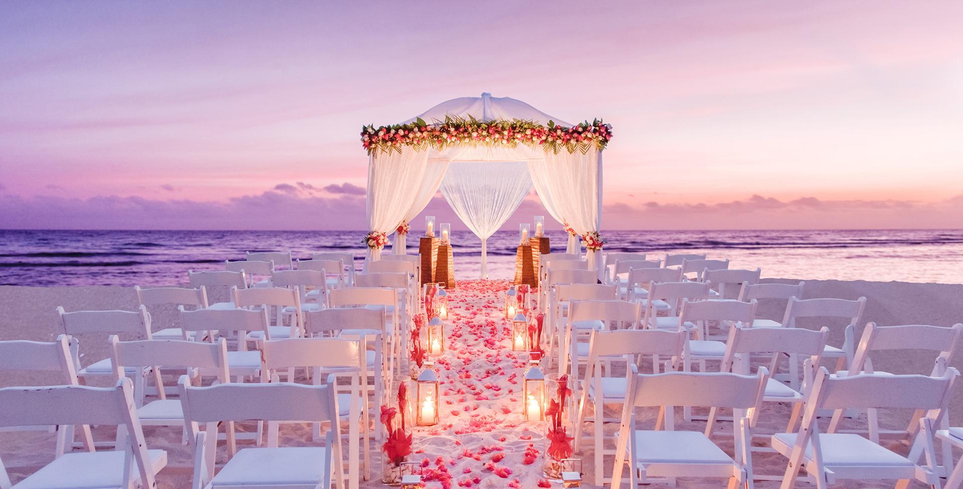 A wedding ceremony set up with chairs and a canopy