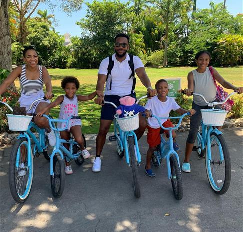 family biking around the resort