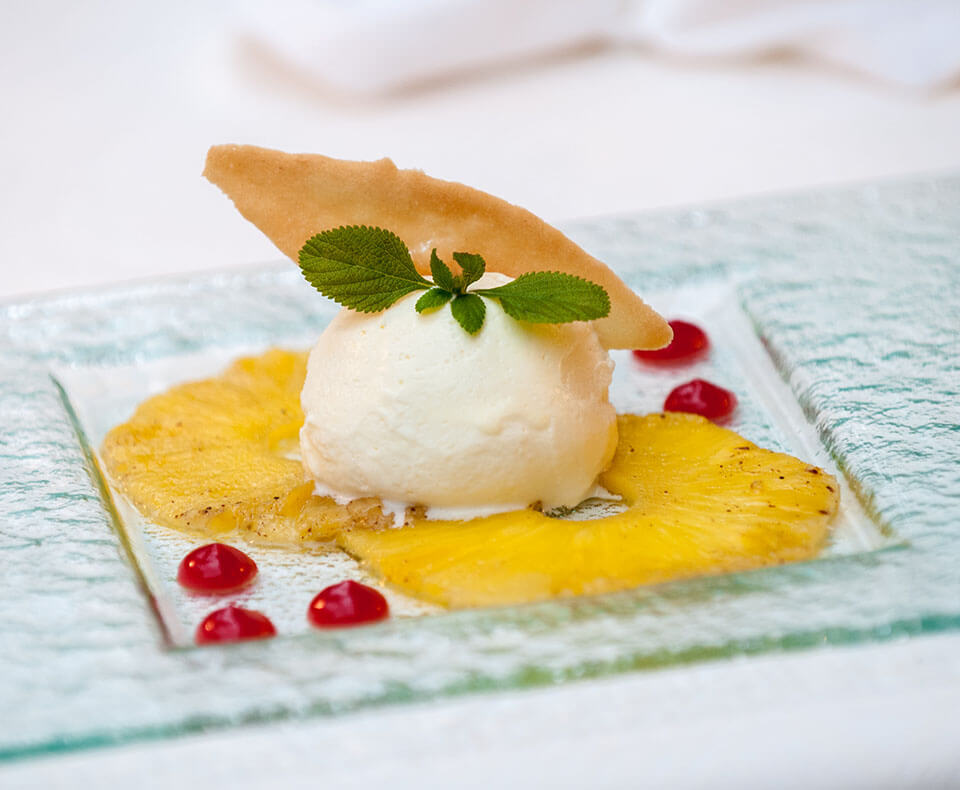 Cold dessert with fresh herb garnish