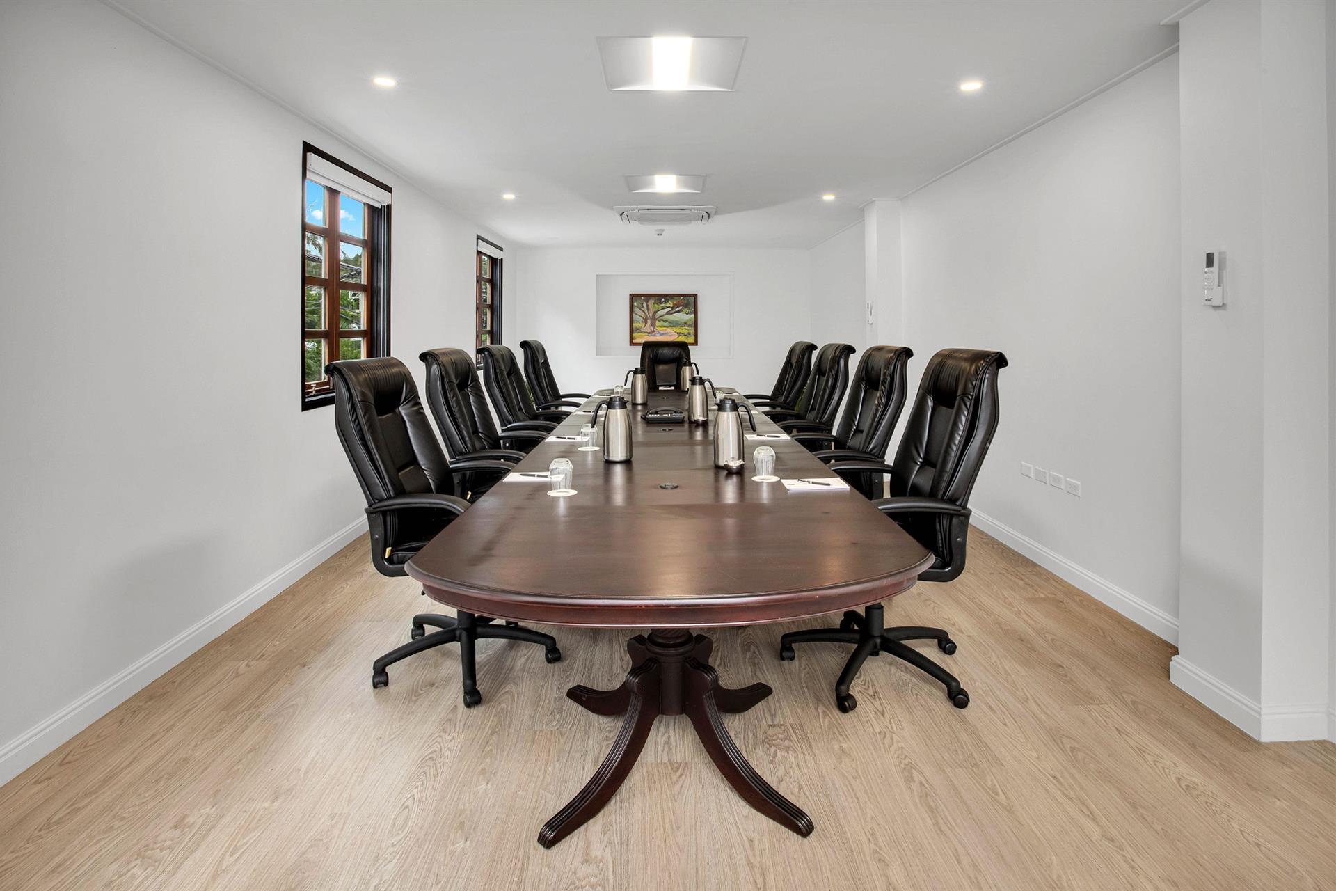 A long conference table with chairs