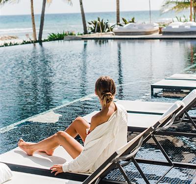woman laying by the pool