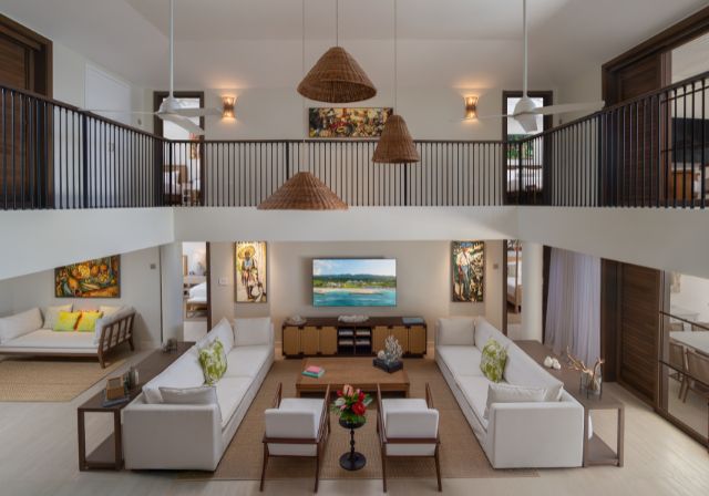 villa interior with upstairs and downstairs, showing sofa and living room area.