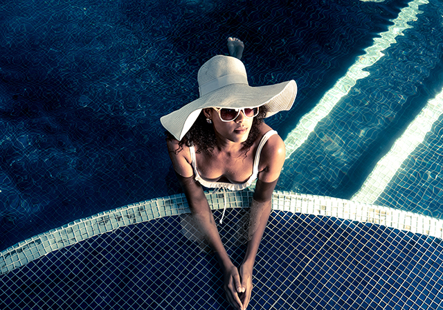 Woman lounging at the pool