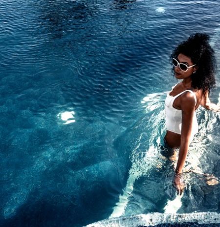 Woman entering pool