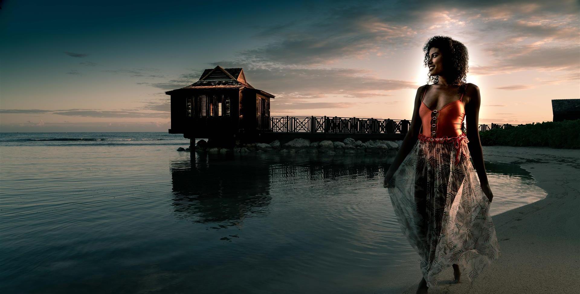 A black woman standing in water