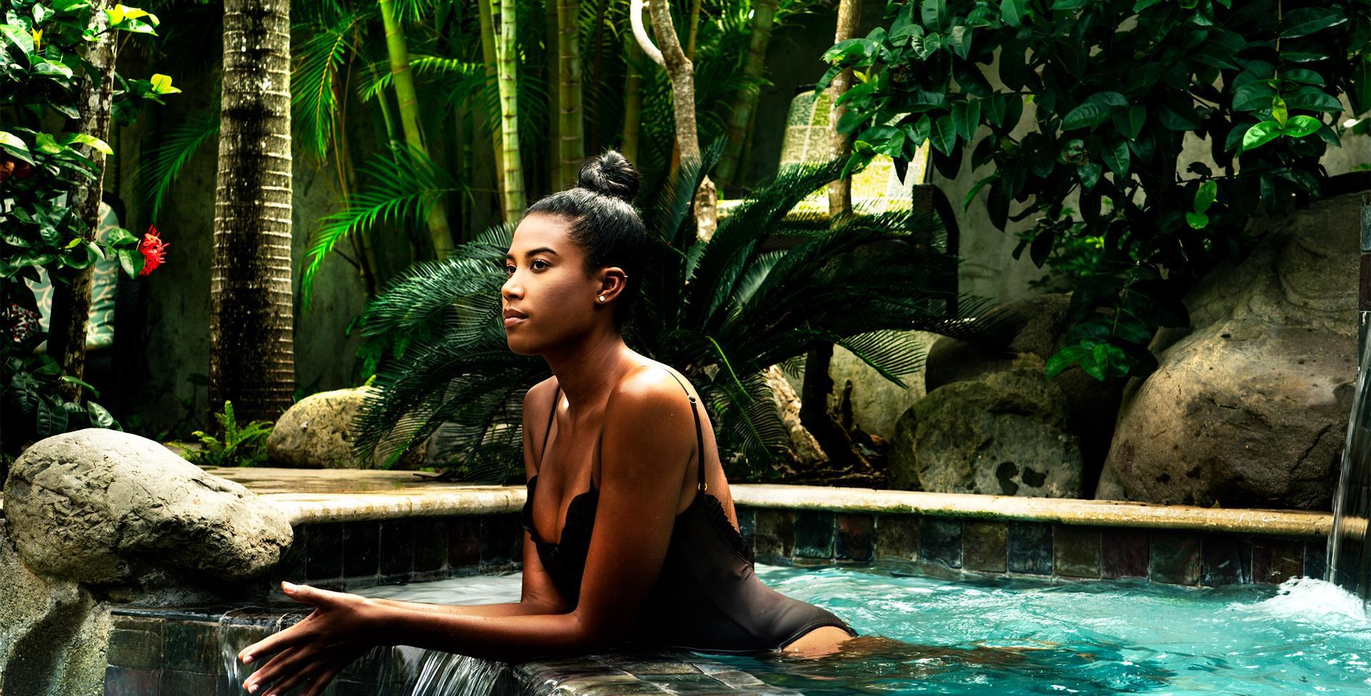 A woman sitting in a pool