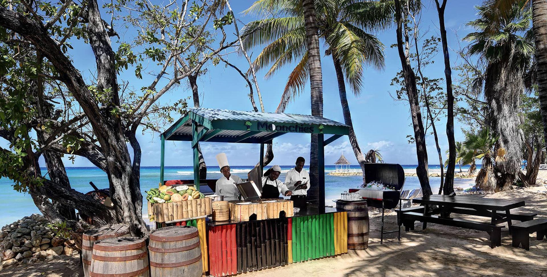 A man playing a grill on a beach