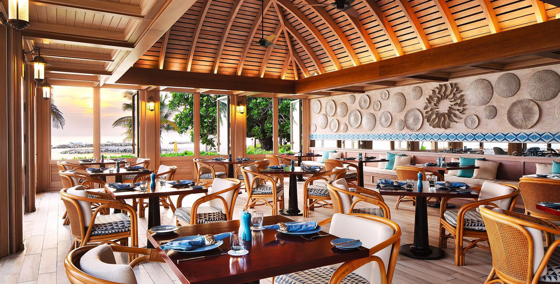 A restaurant with tables and chairs