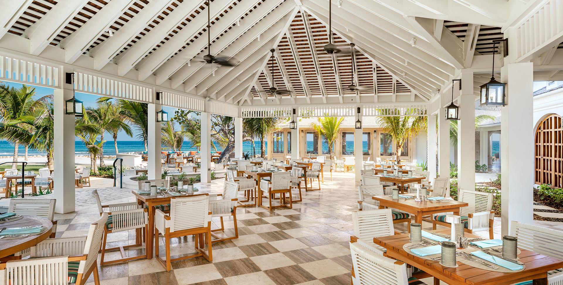 A restaurant with tables and chairs