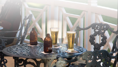 a table with beer bottles and glasses on it