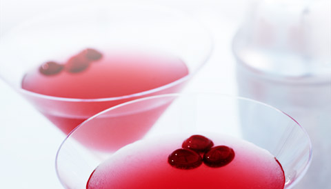 close-up of a few glasses of red liquid