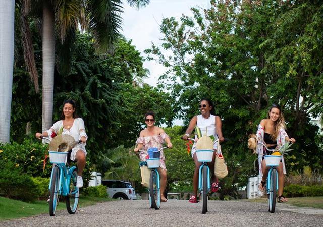 Four individuals on bikes
